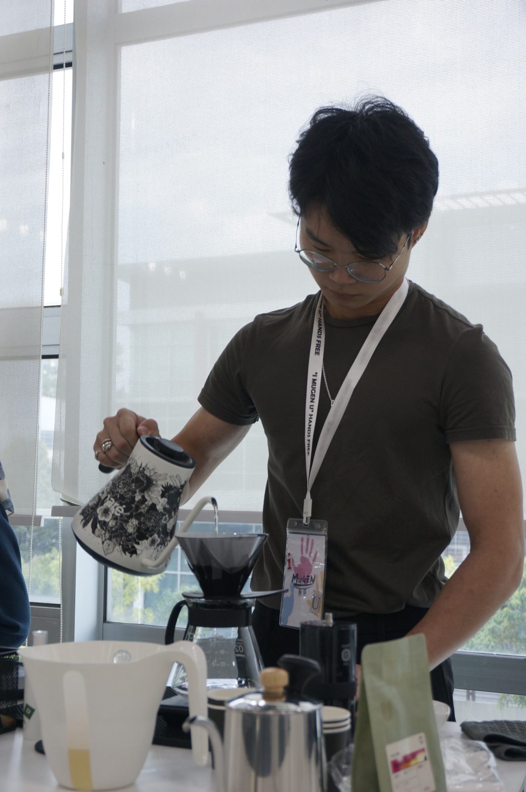 A competitor pouring at the Hands-Free pour-over contest