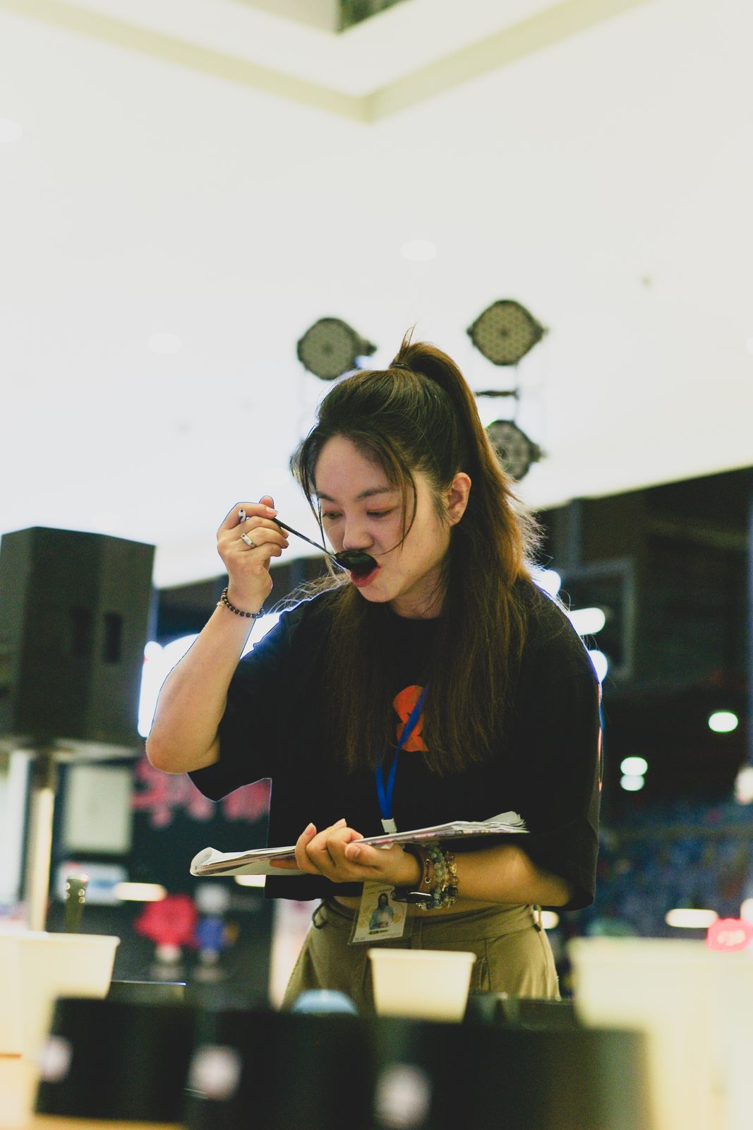 A judge slurping from a cupping spoon during blind scoring